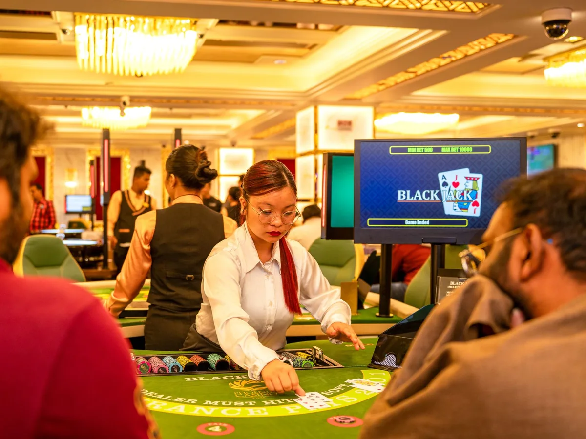 Hotel casino floor with table games and sports betting area