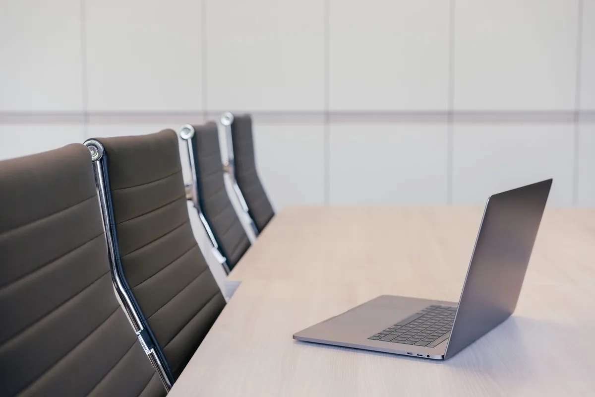 corporate office meeting room laptop