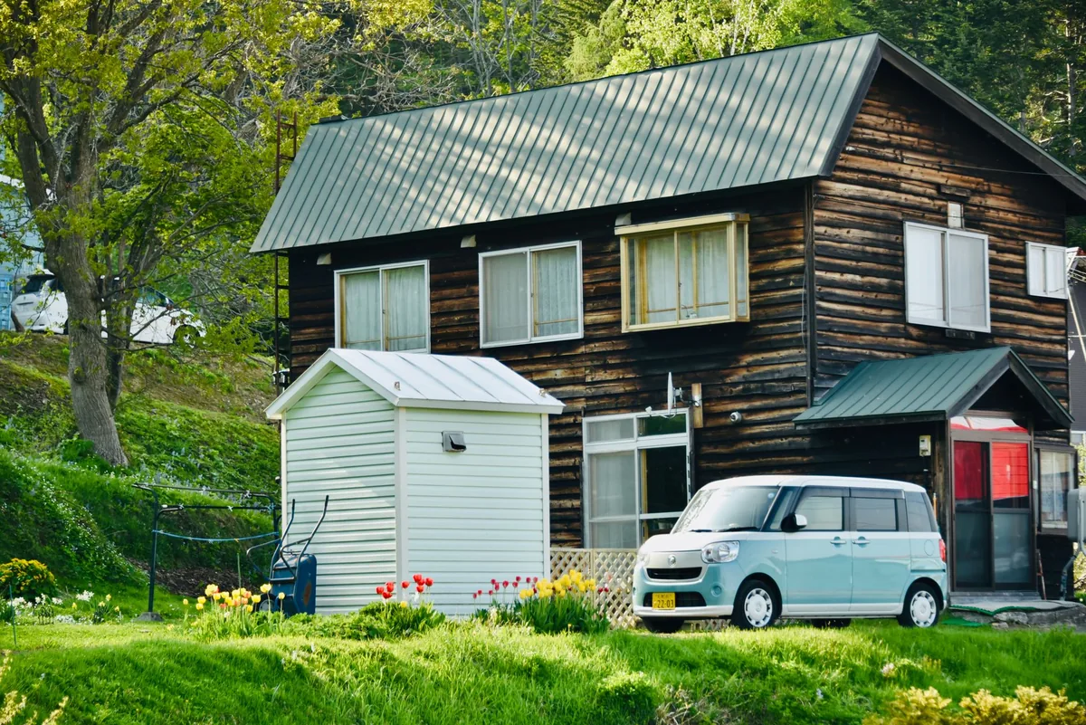 compact rental car parked outside residential holiday home