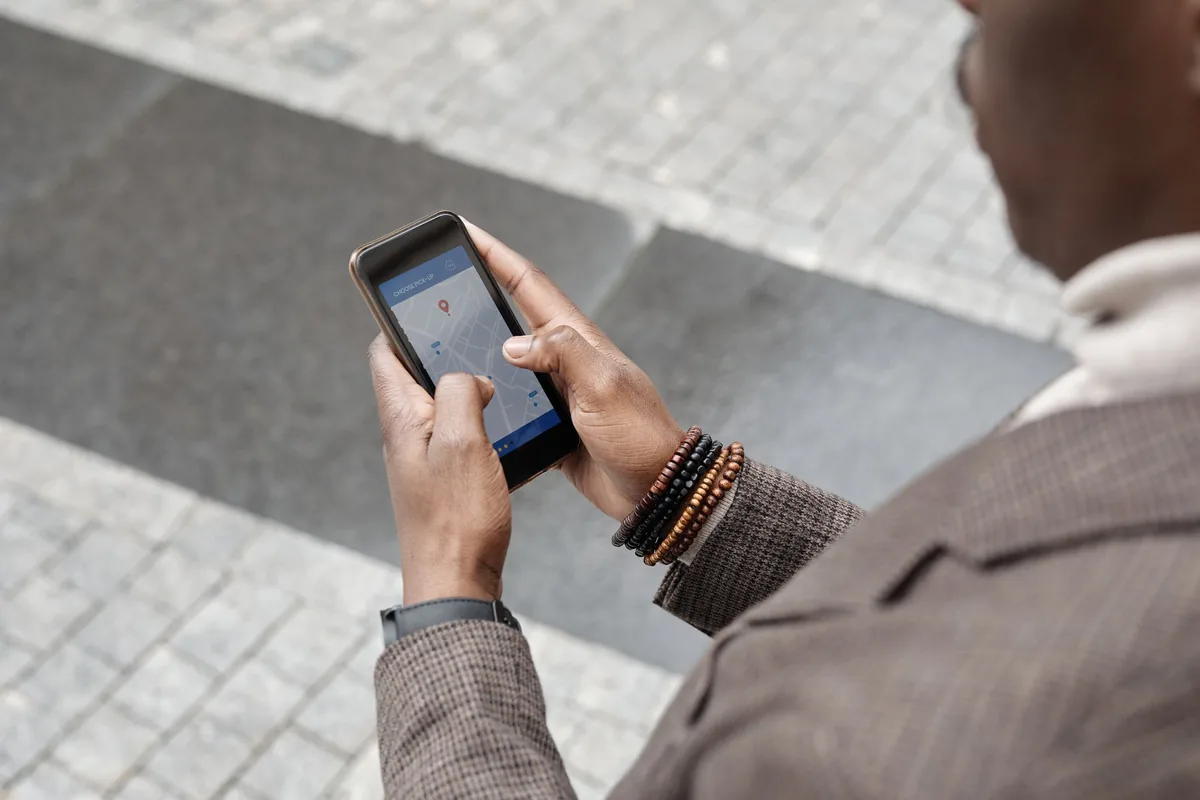 businessman using smartphone travel app