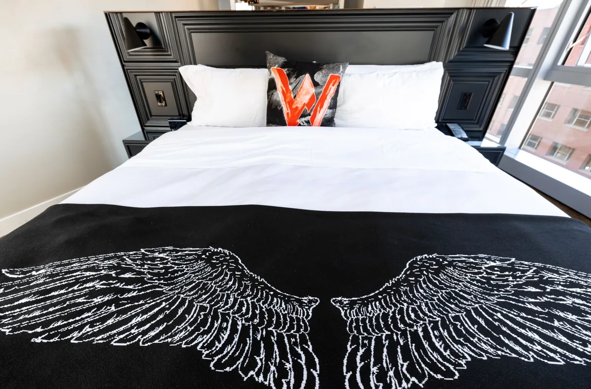 luxury hotel room bed with city view
