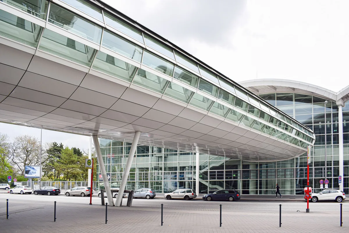elevated pedestrian bridge connecting a modern hotel to a conference center