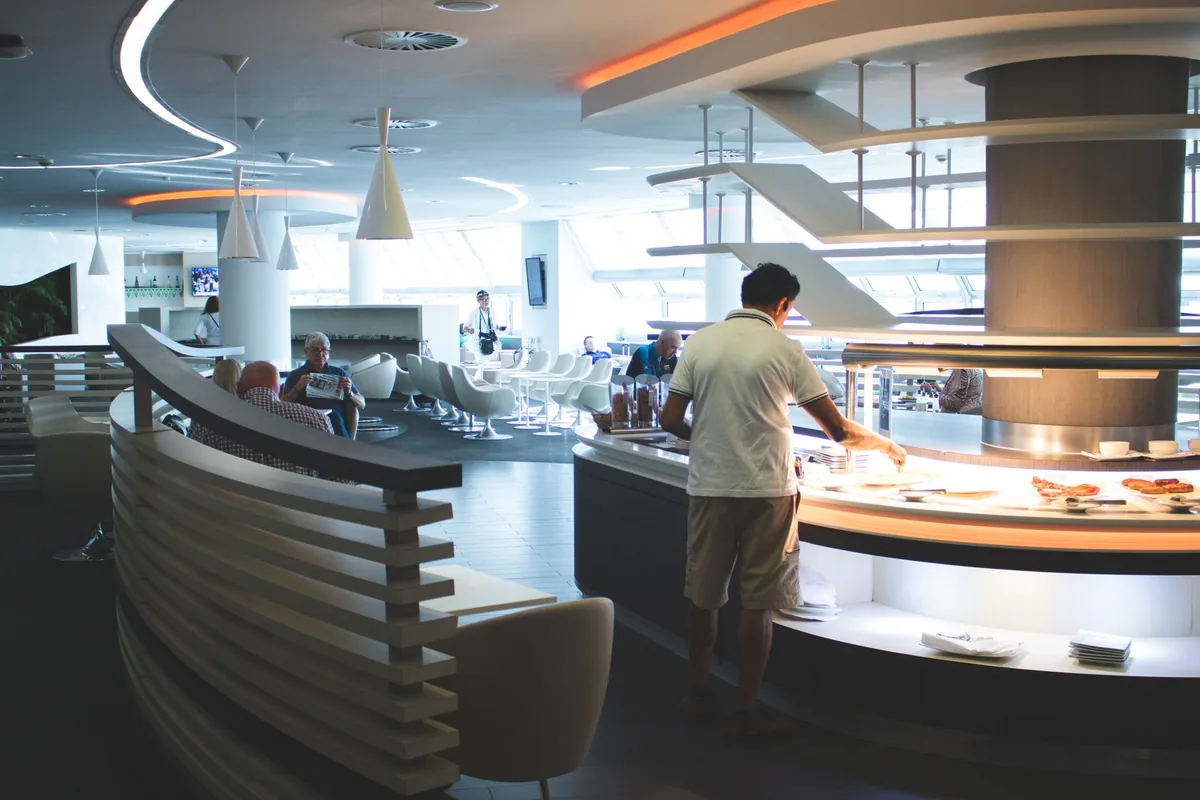 hotel executive lounge with comfortable seating and a breakfast buffet