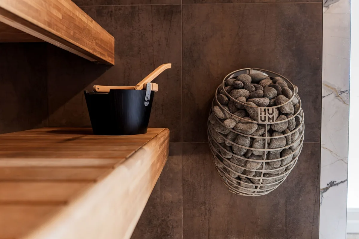 luxury urban bathhouse sauna room with warm wooden benches
