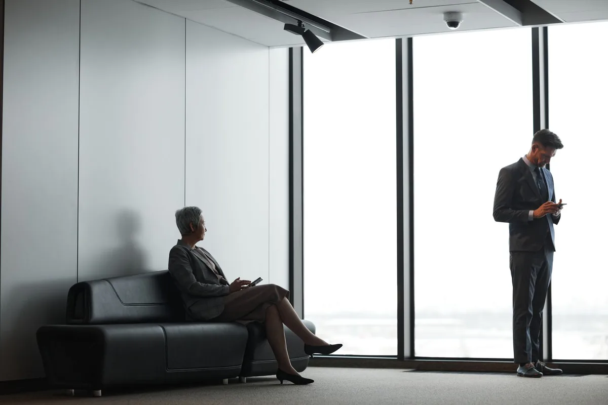 business executive typing on tablet in hotel lounge