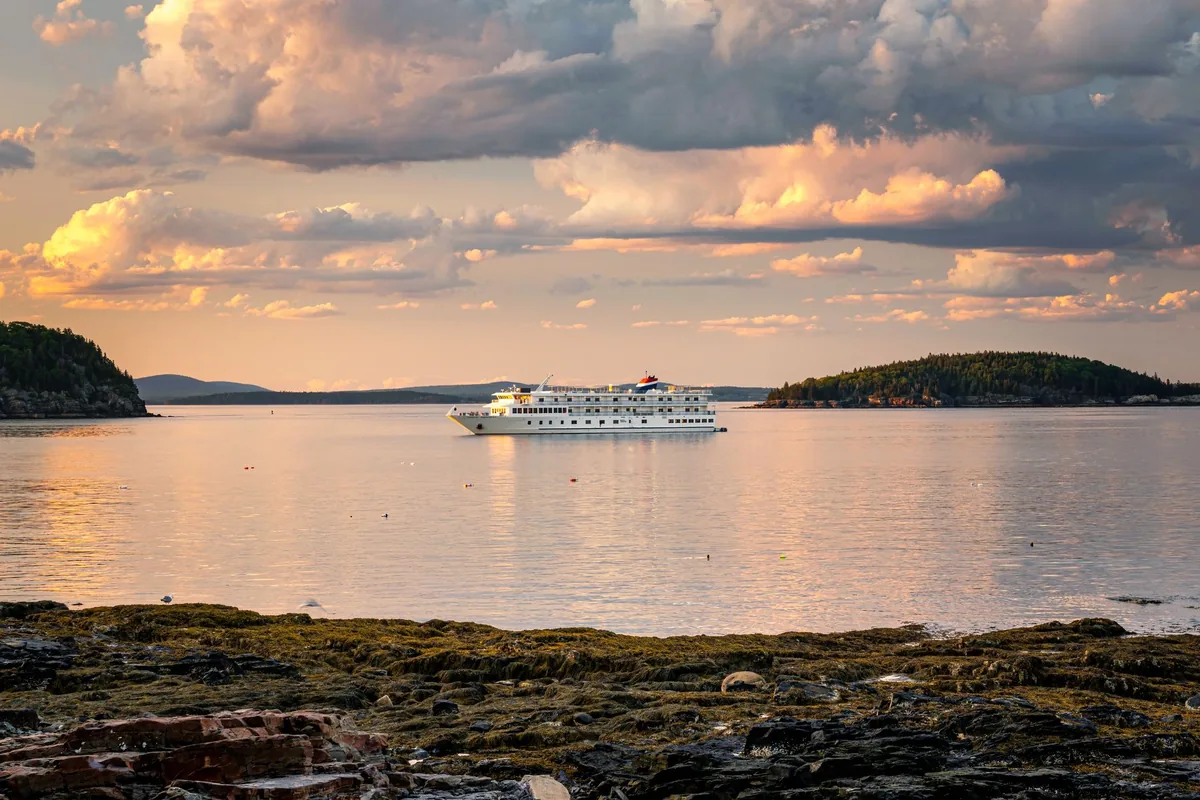 cruise ship sailing scenic national park mountains