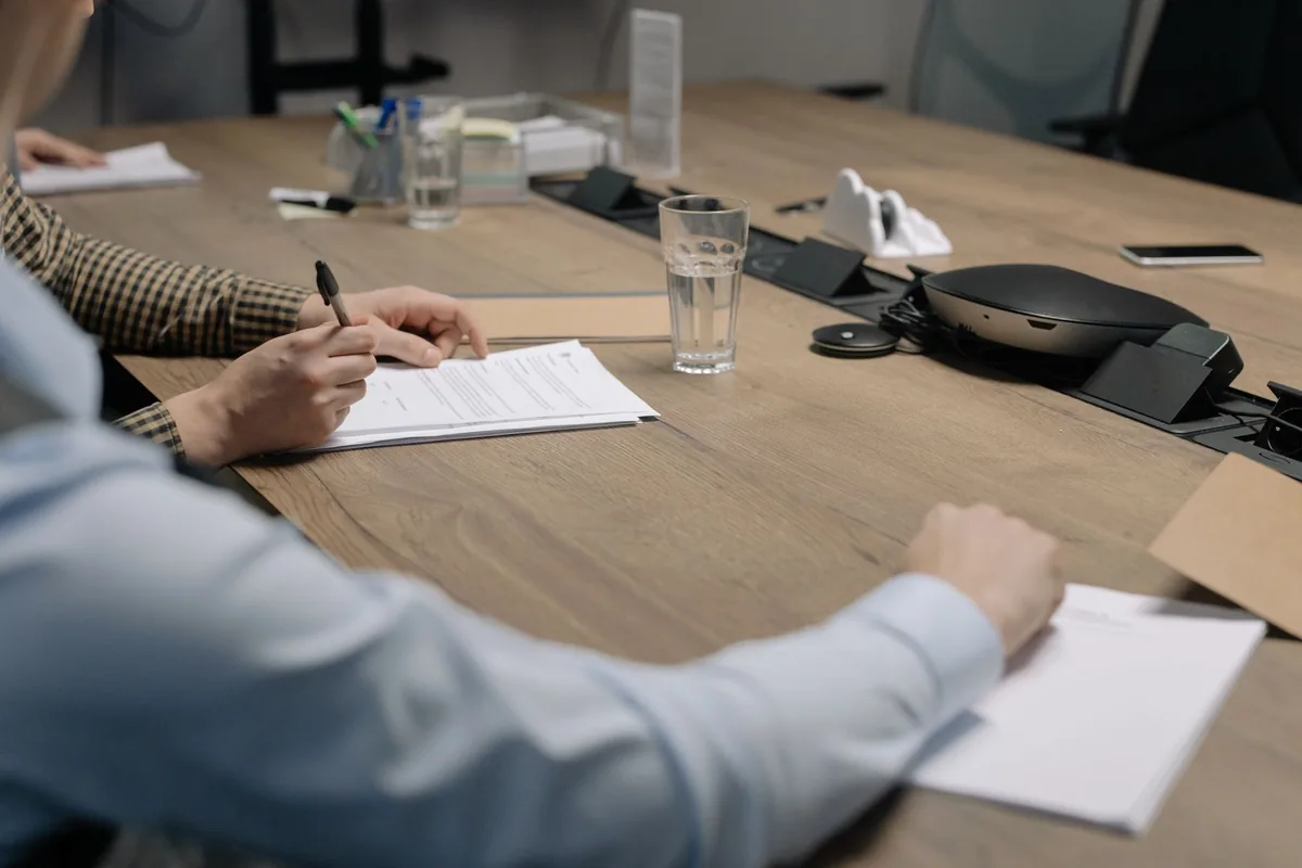 corporate boardroom table financial documents