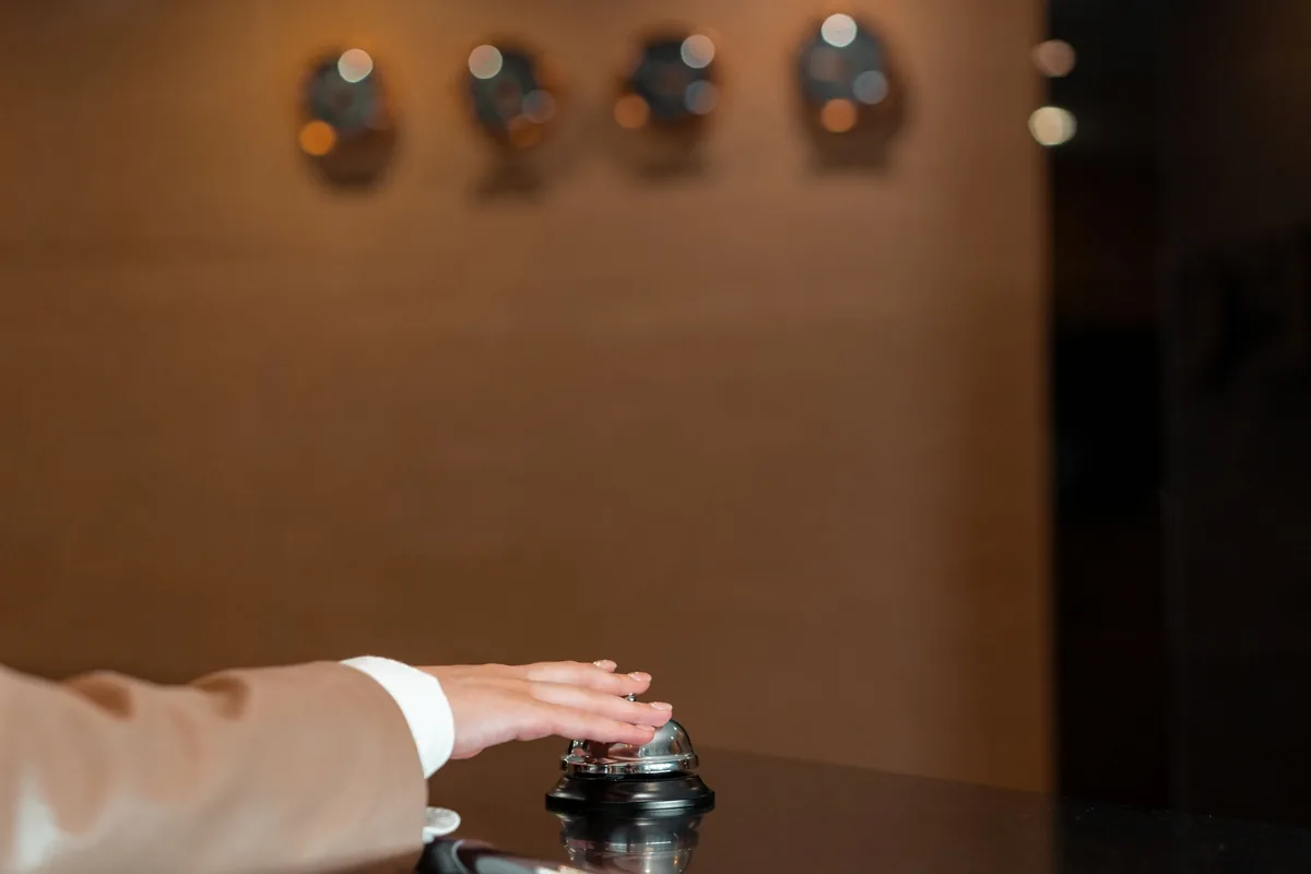 hotel reception desk with guest checking in