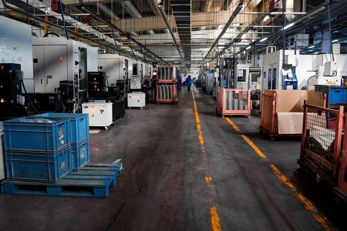 industrial manufacturing facility floor with automated machinery