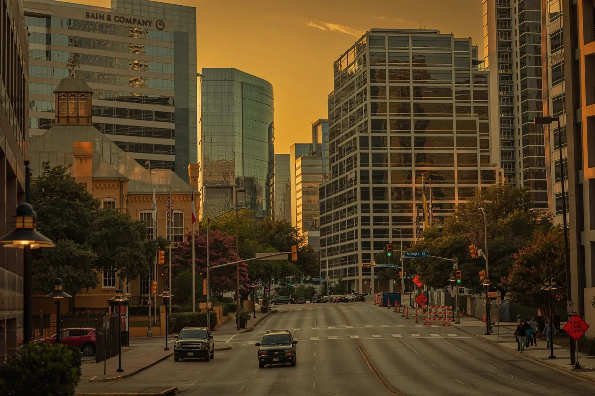 Dallas city skyline at sunset showing commercial buildings