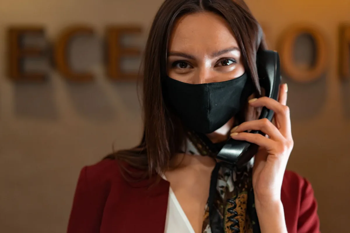 hotel reception desk staff answering phone