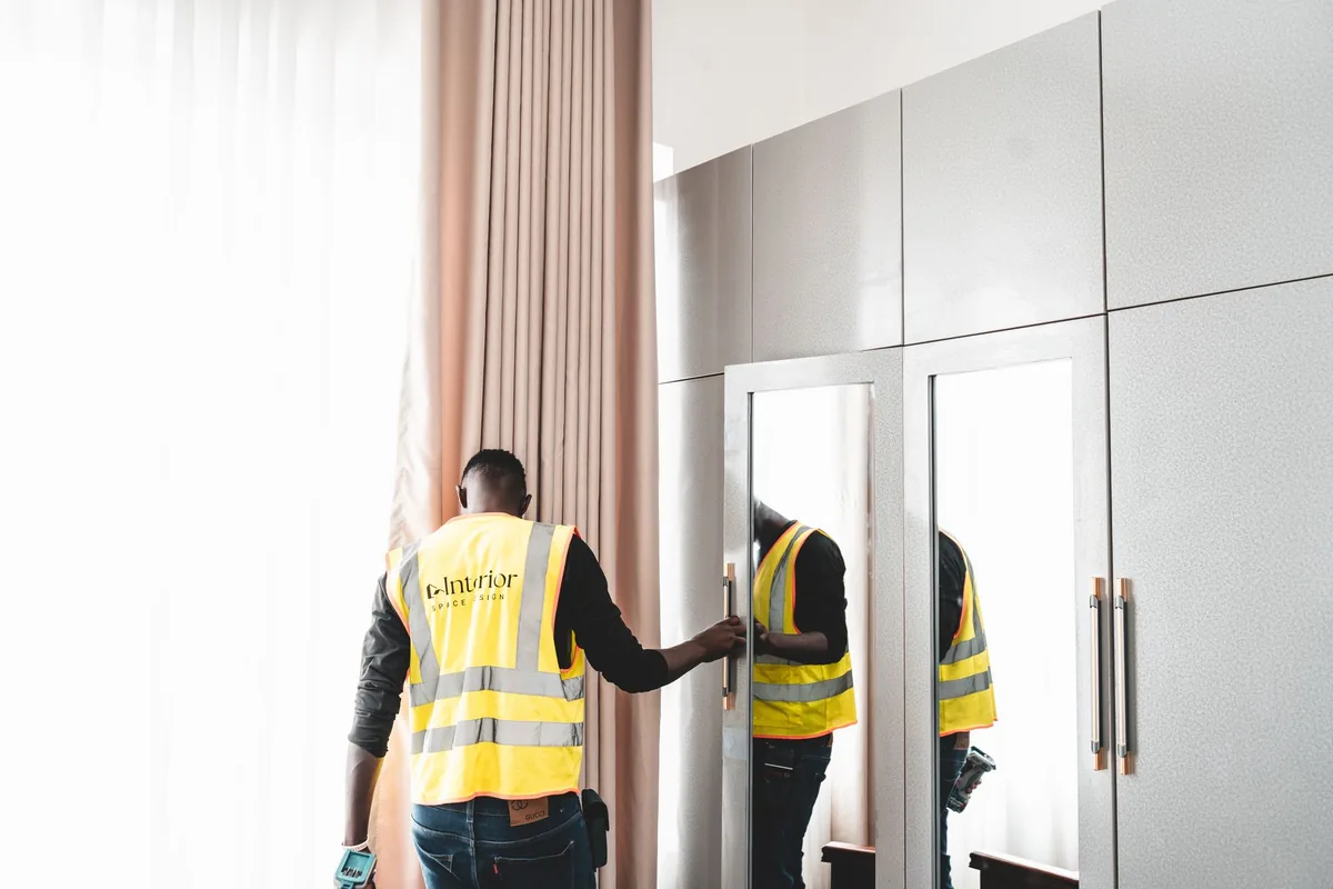 hotel maintenance worker inspects room