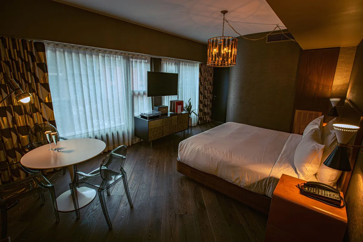 boutique hotel guestroom high ceilings large windows