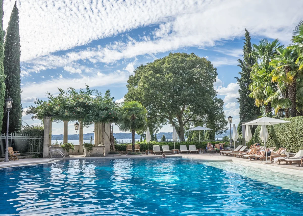 outdoor hotel swimming pool with lounge chairs