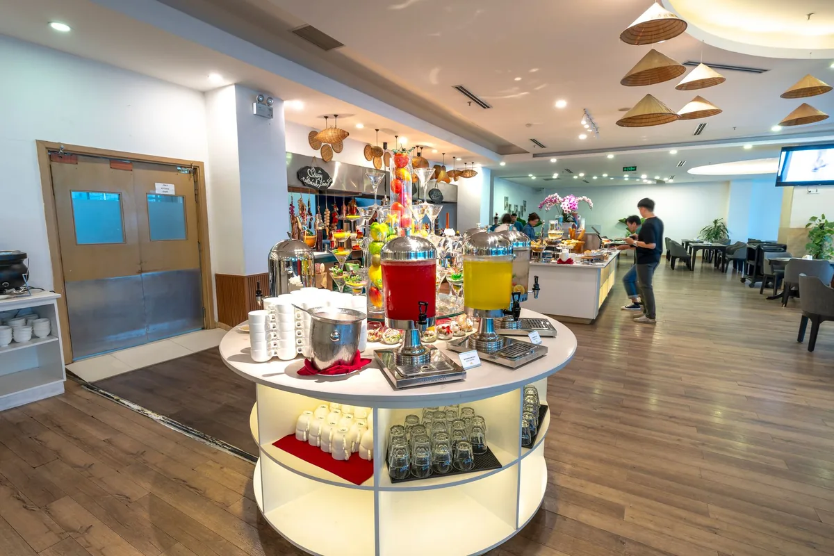 hotel lobby breakfast buffet area with hot food stations