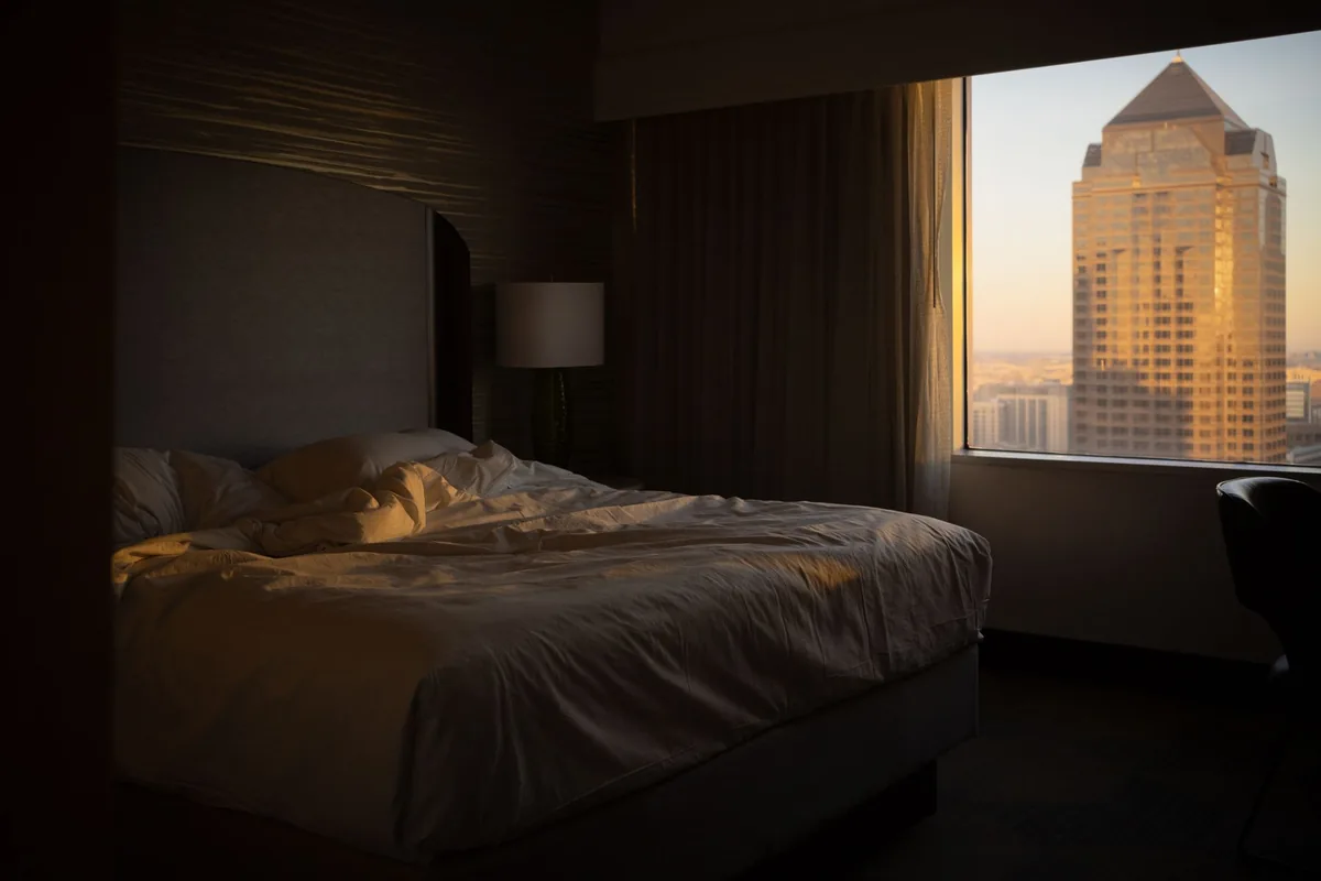 hotel bedroom with city view