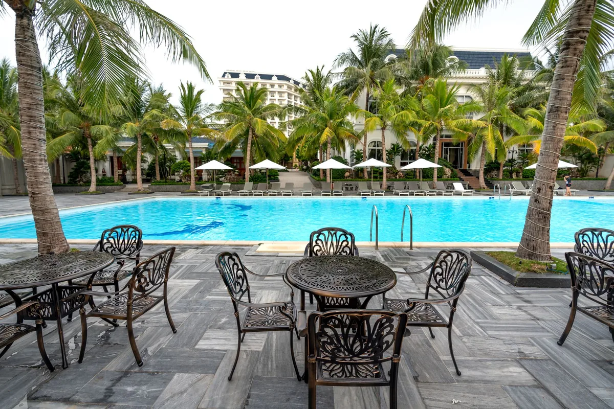 hotel swimming pool sun loungers patio