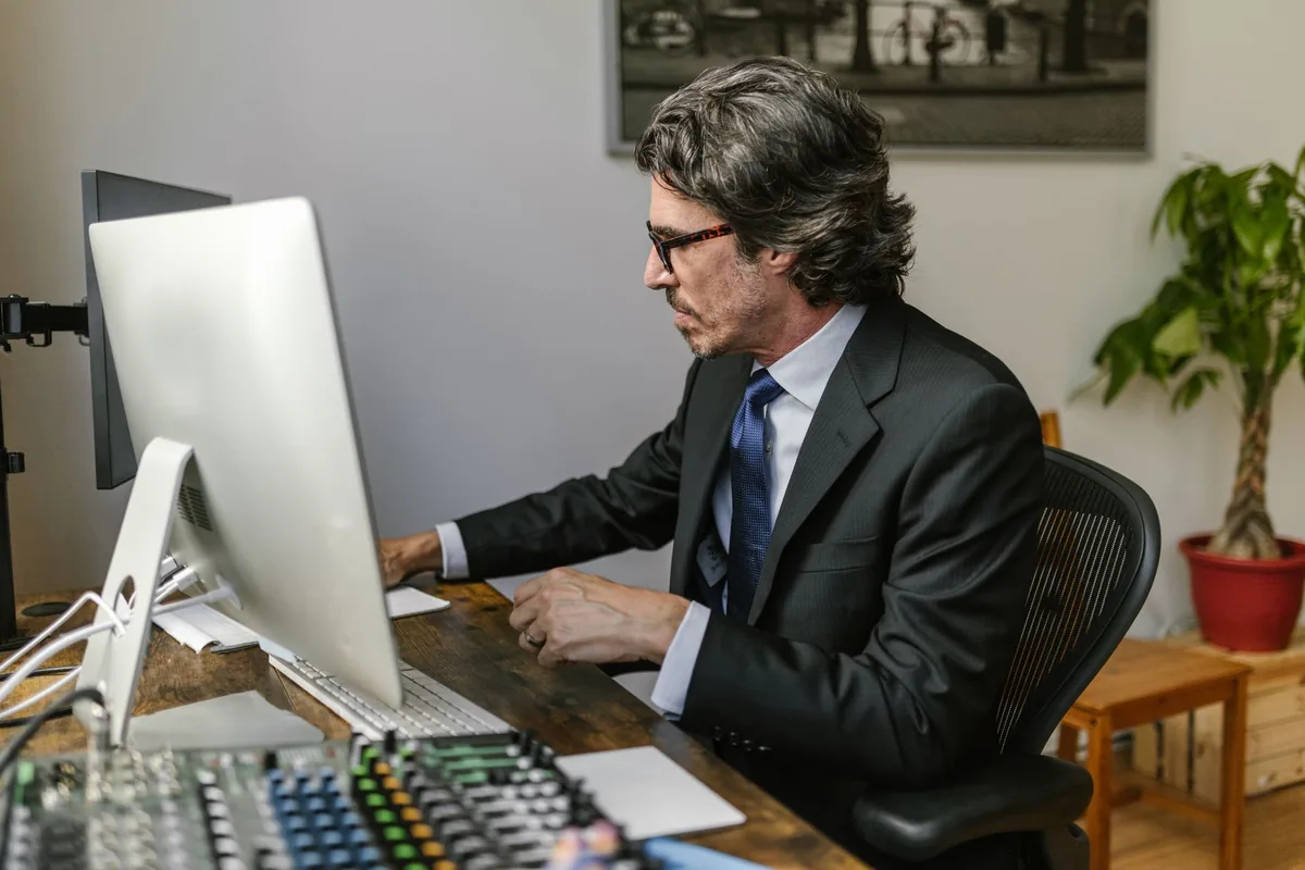 hotel manager working on desktop computer