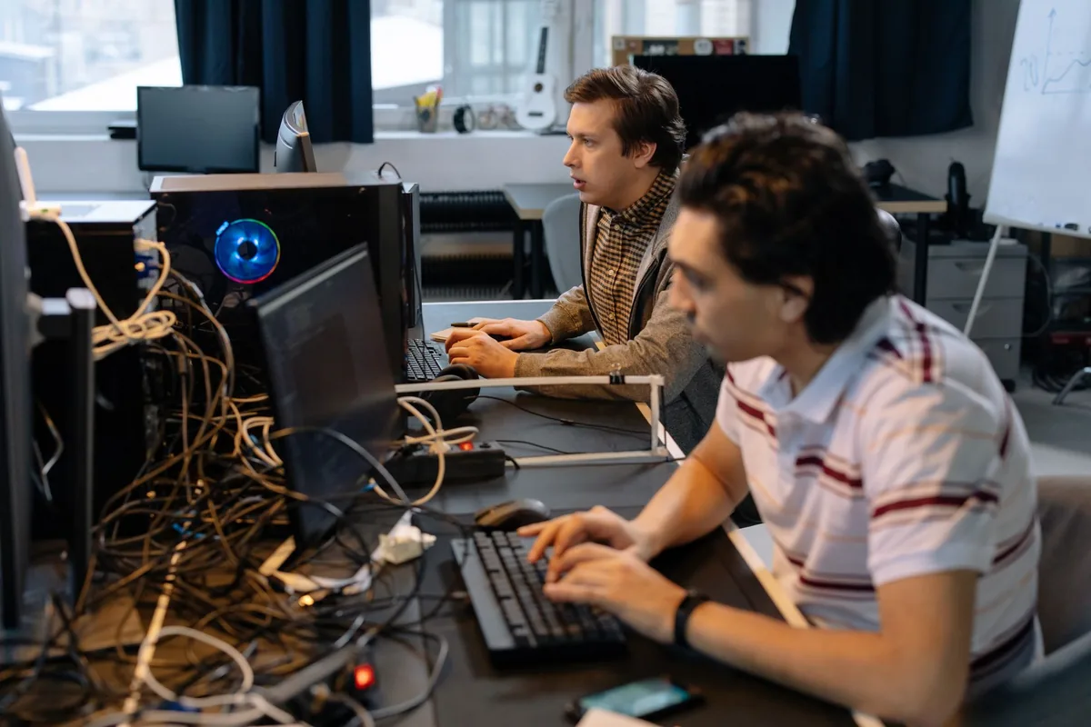 software engineers working on computer monitors