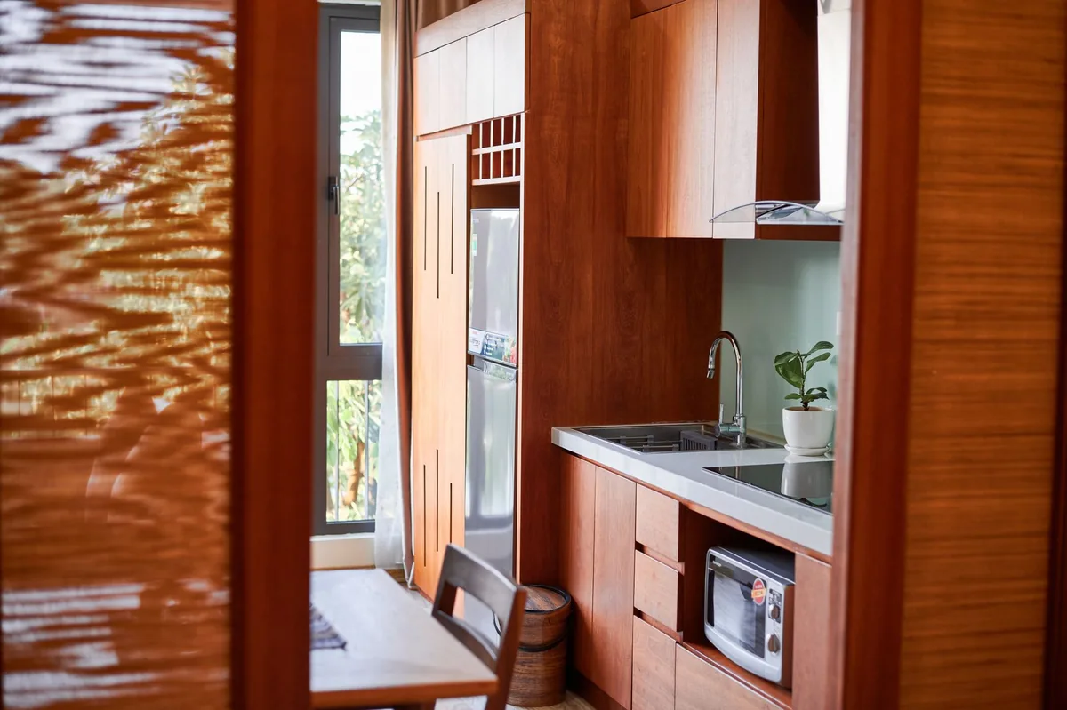 hotel room full kitchen with microwave and full-size refrigerator