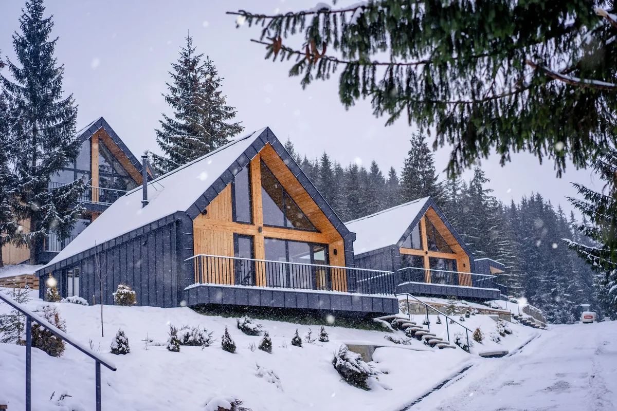 mountain resort exterior with snow and timber details