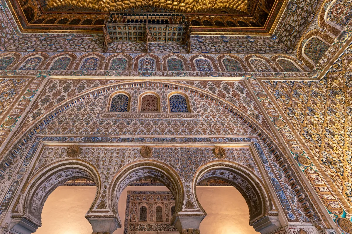 intricate historic interior staircase with mosaic tilework