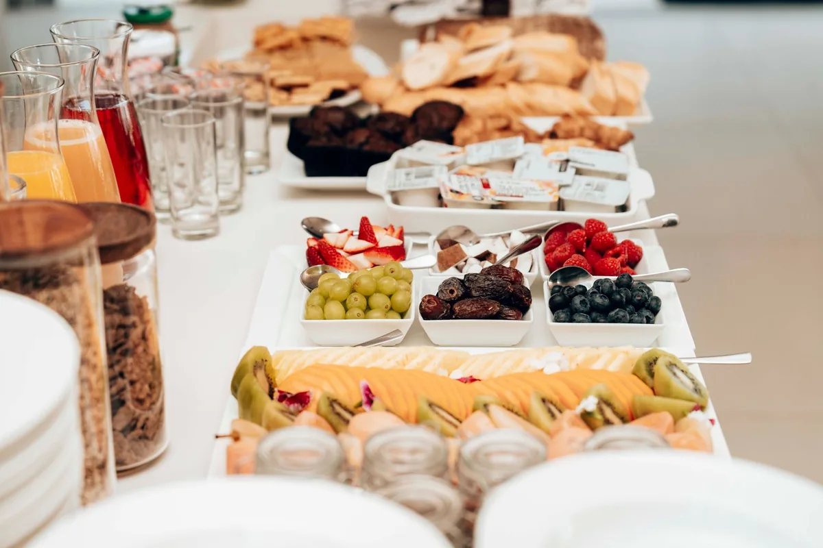hotel breakfast buffet with fresh fruit and pastries
