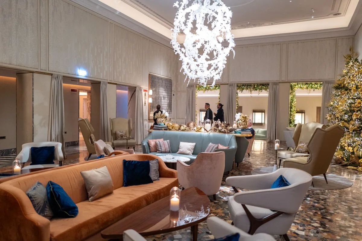 luxury hotel lobby with high ceilings and modern seating