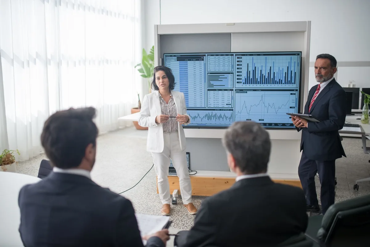 business professional presenting marketing campaign on screen