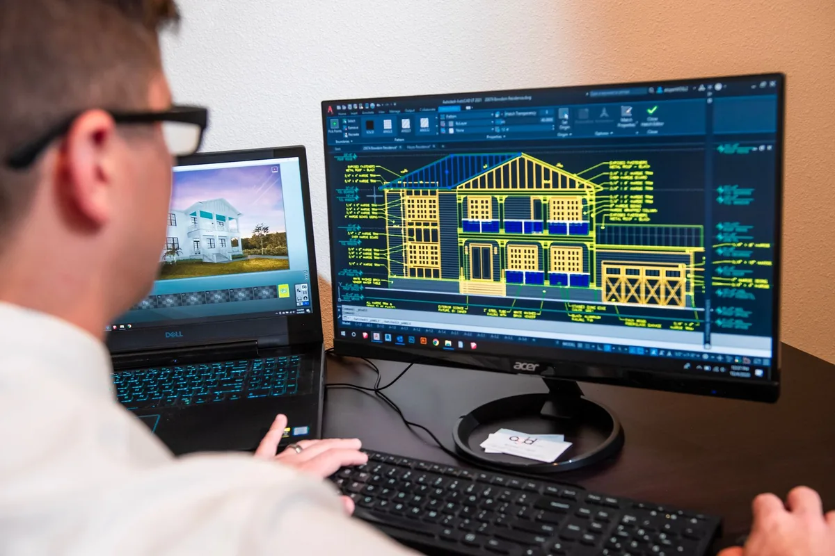 hotel management revenue manager working computer monitors