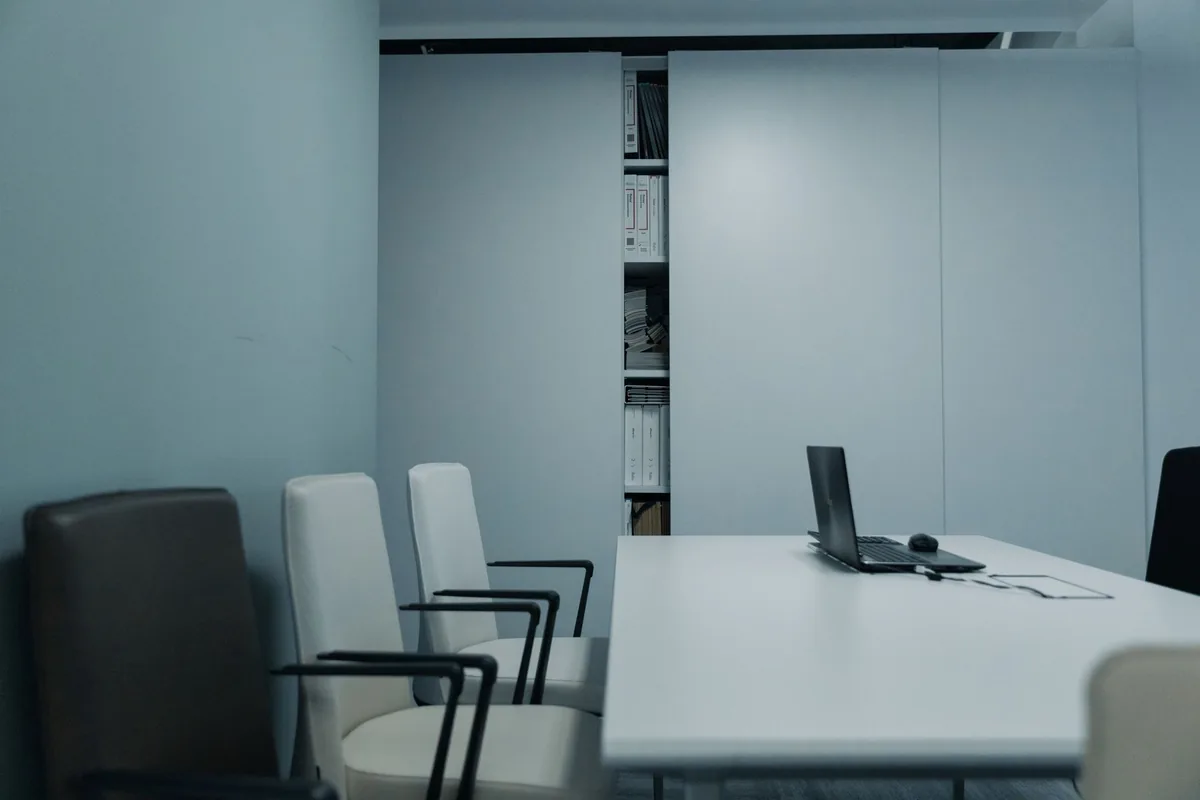 corporate board room table empty chairs