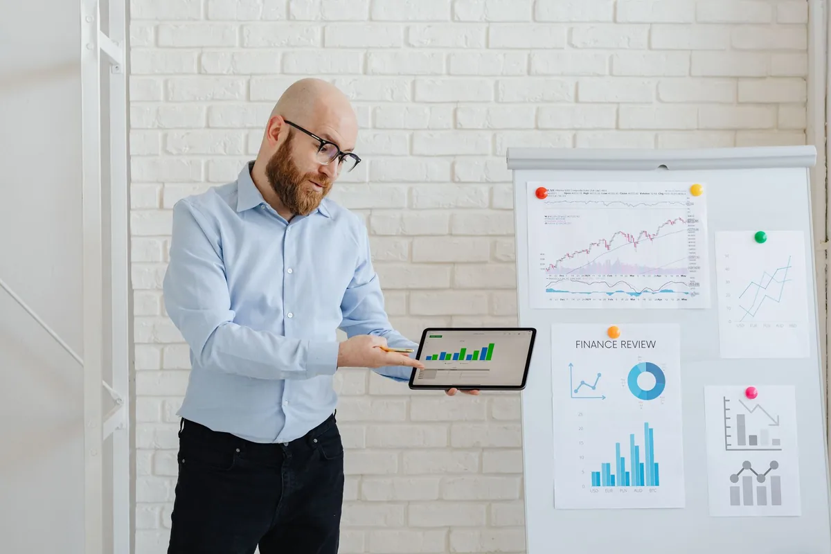 hotel manager analyzing revenue reports on tablet