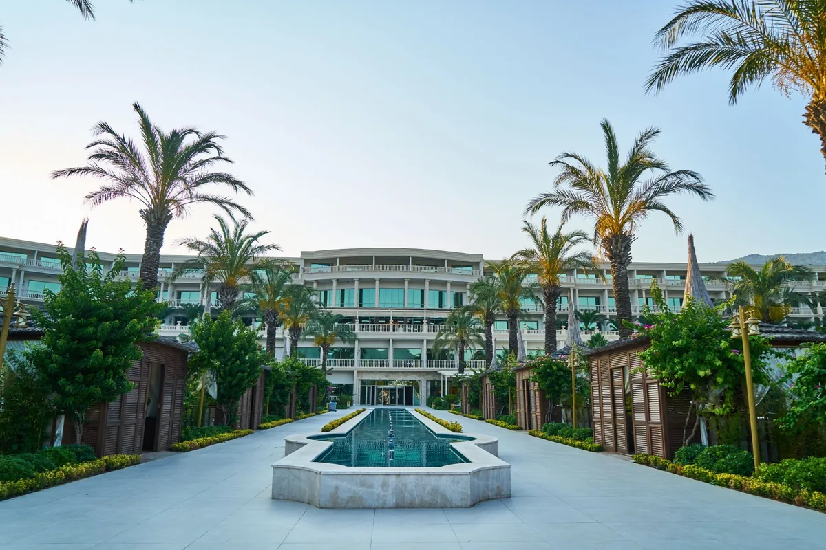 luxury hotel exterior building palm trees