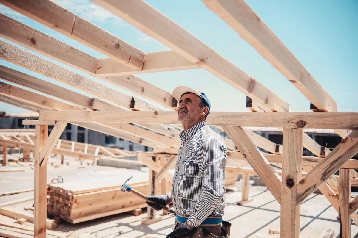 construction site with workers and wooden framing