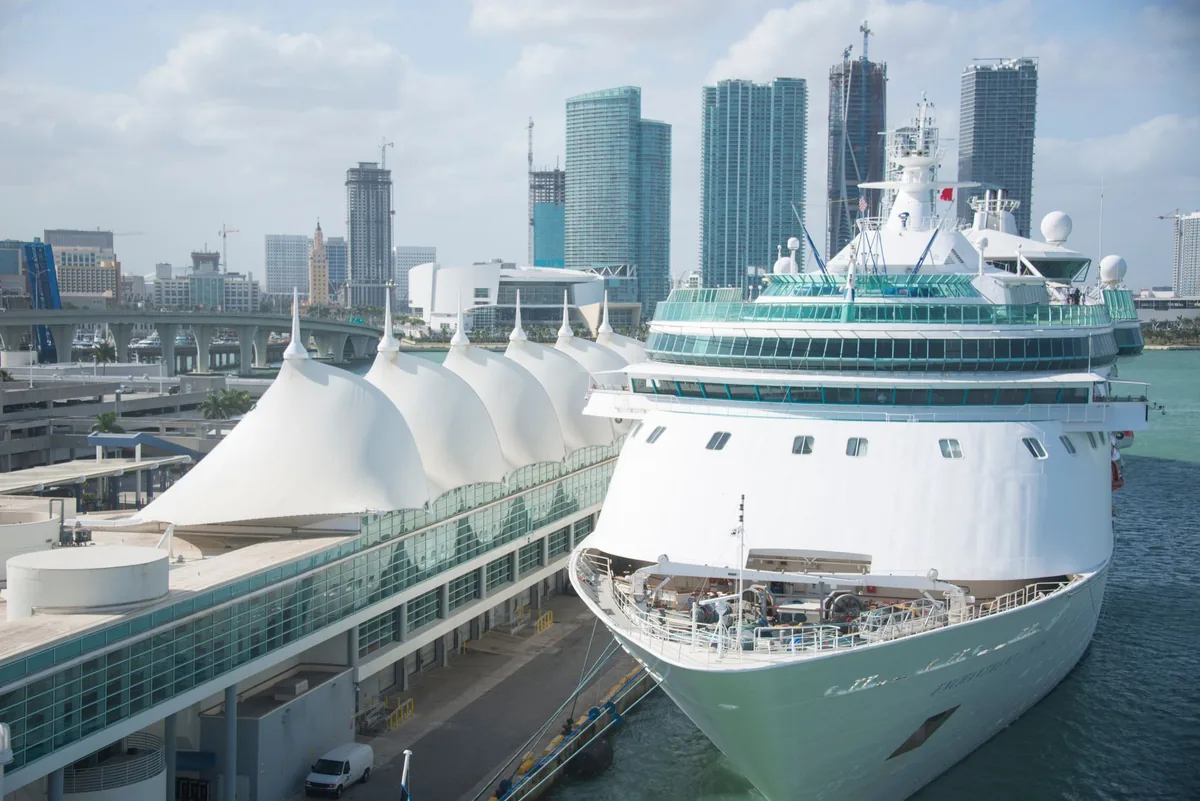 cruise ship docked at modern port terminal