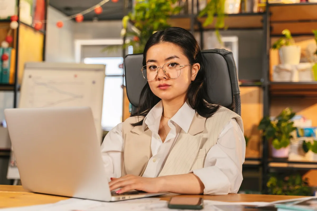 hotel manager working on laptop in modern office