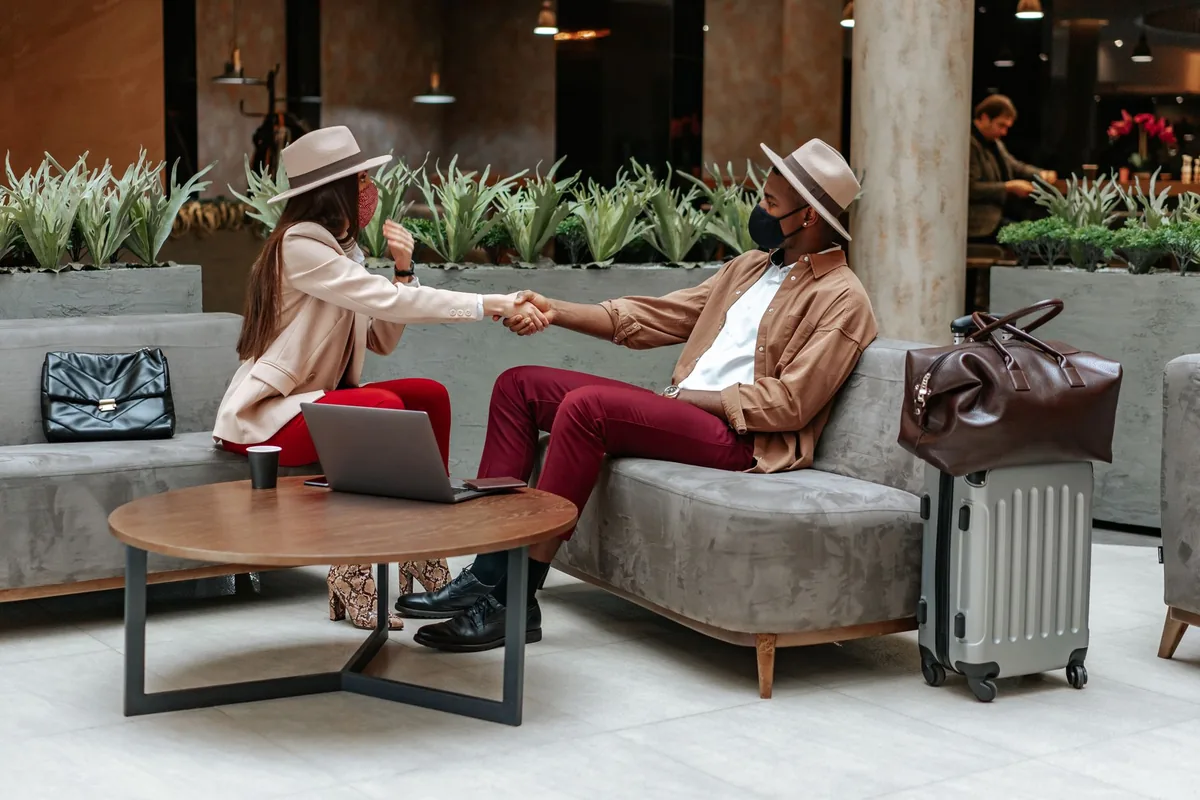 modern hotel lobby lounge with travelers