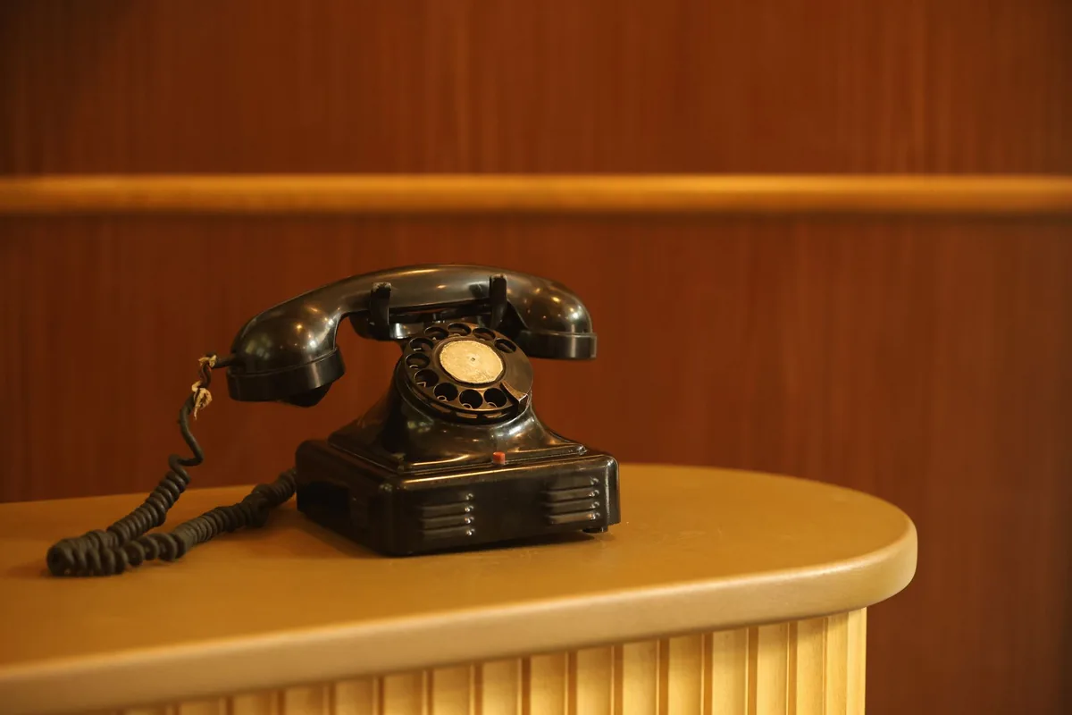hotel reception desk telephone computer