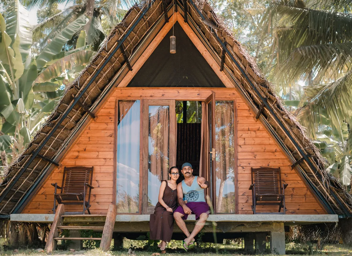 hotel guest using a smartphone in a cabana