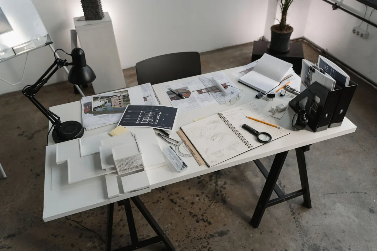 architectural blueprints on a desk in a design office