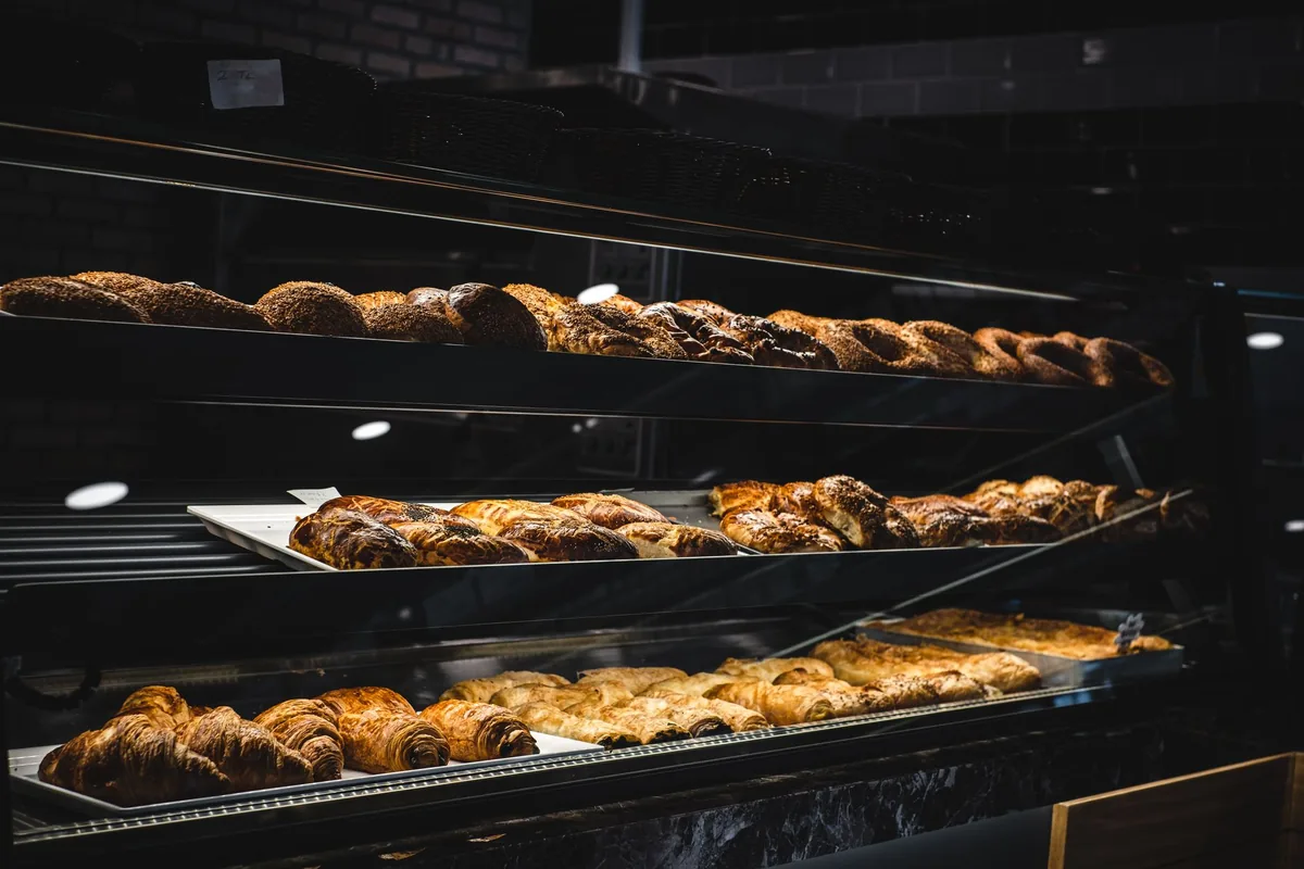 artisan bakery display counter with croissants