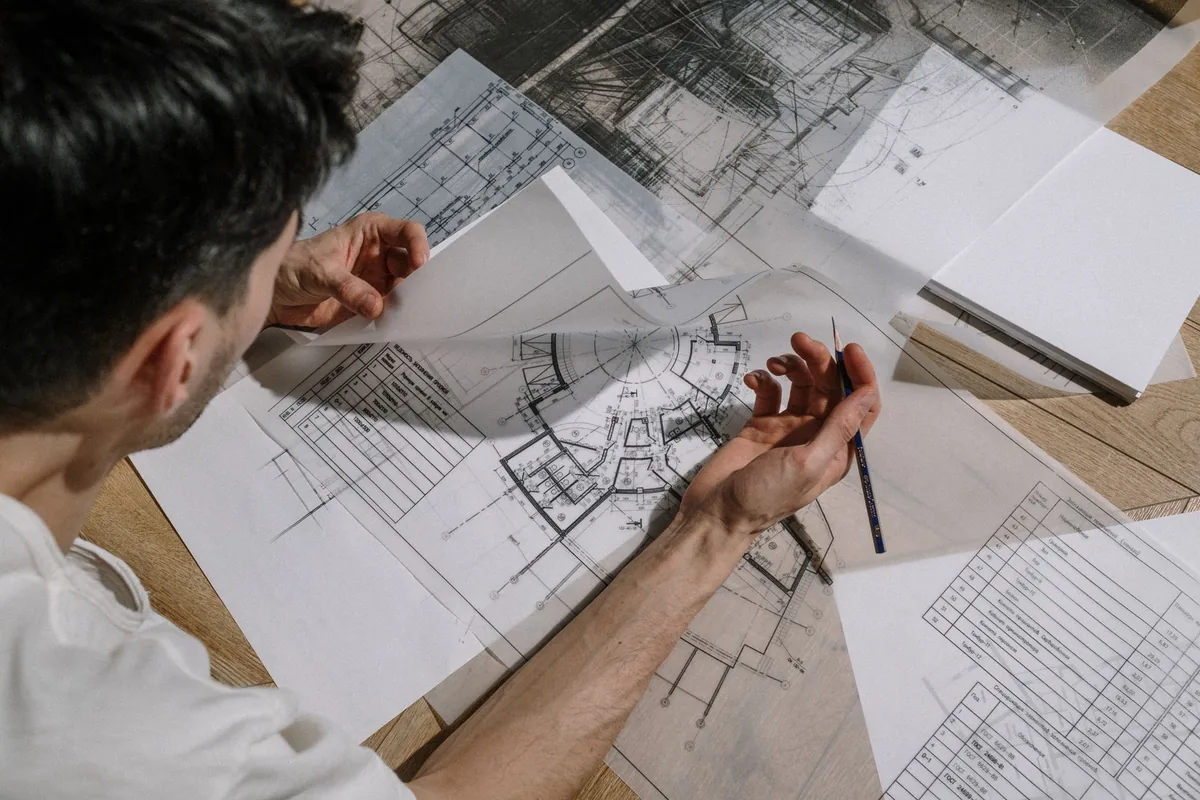 hotel executive reviewing blueprints