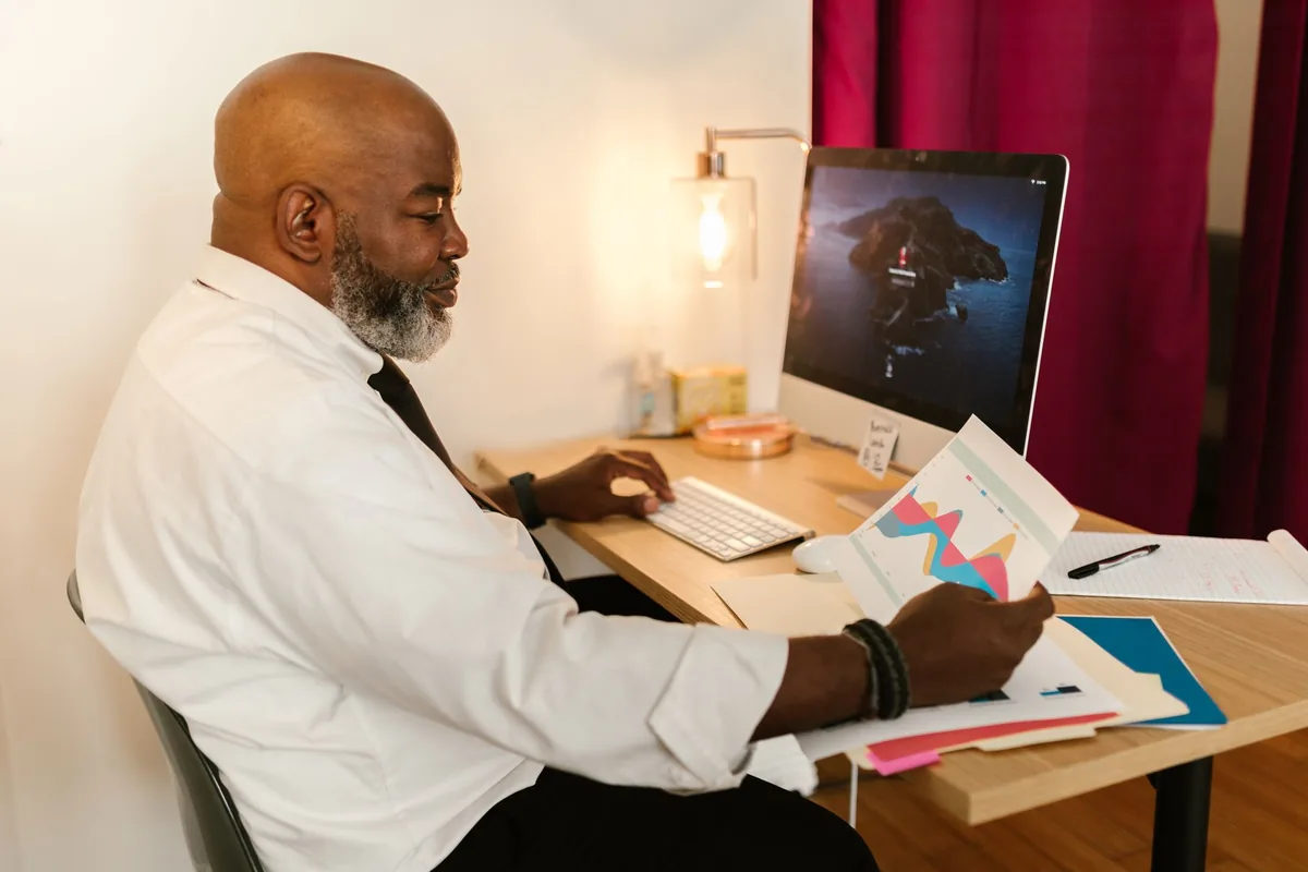 hotel manager reviewing revenue dashboard computer
