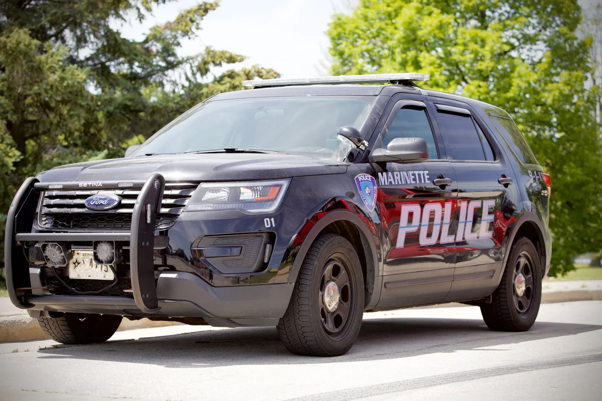 police cruiser parked outside hotel entrance