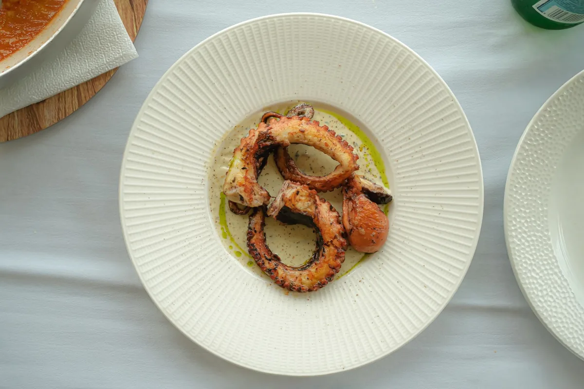 fresh Mediterranean octopus dish restaurant table