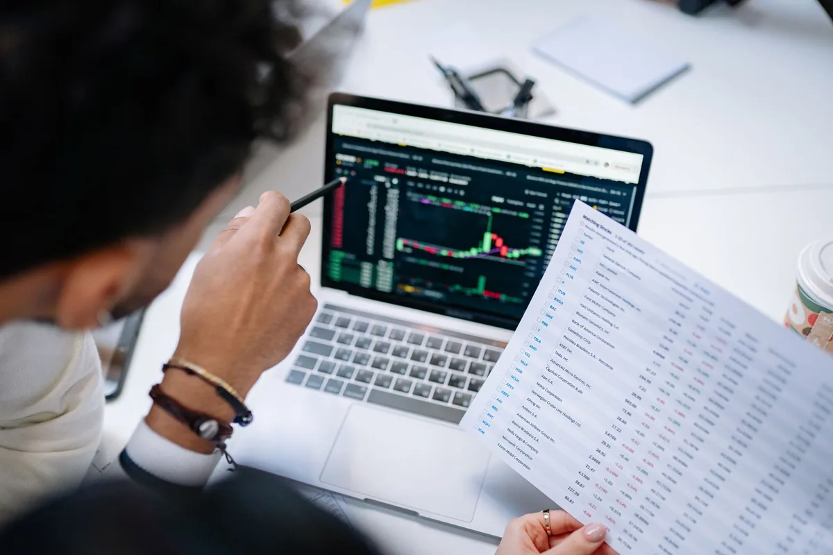 marketing executive analysing performance metrics laptop