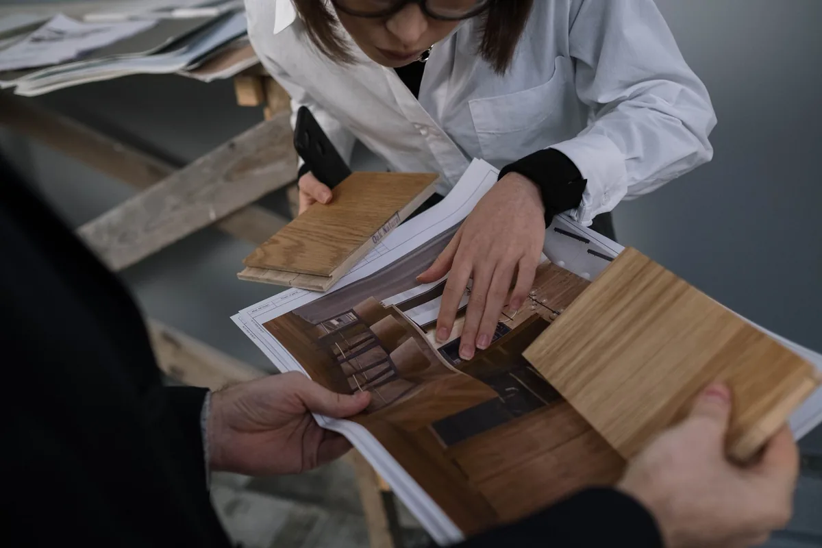 executive discussing architectural floor plans