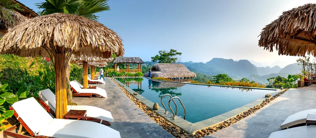 hotel outdoor pool deck cabanas lounge seating
