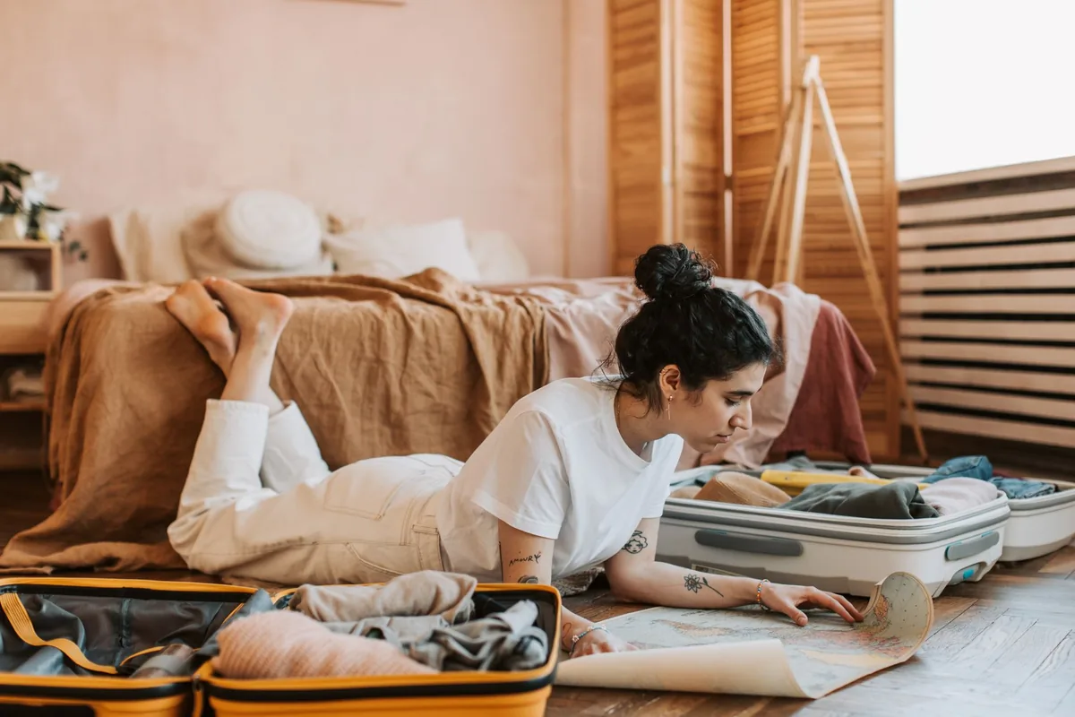 couple reviewing travel itinerary hotel room
