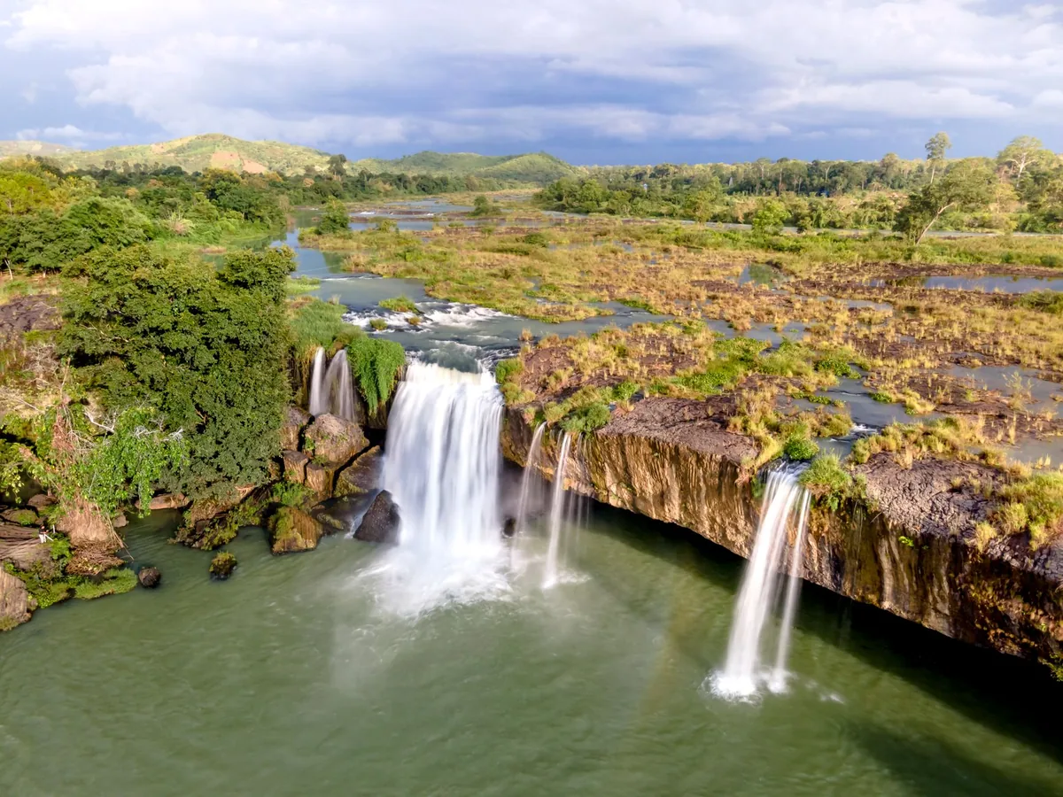 waterfall river lush greenery